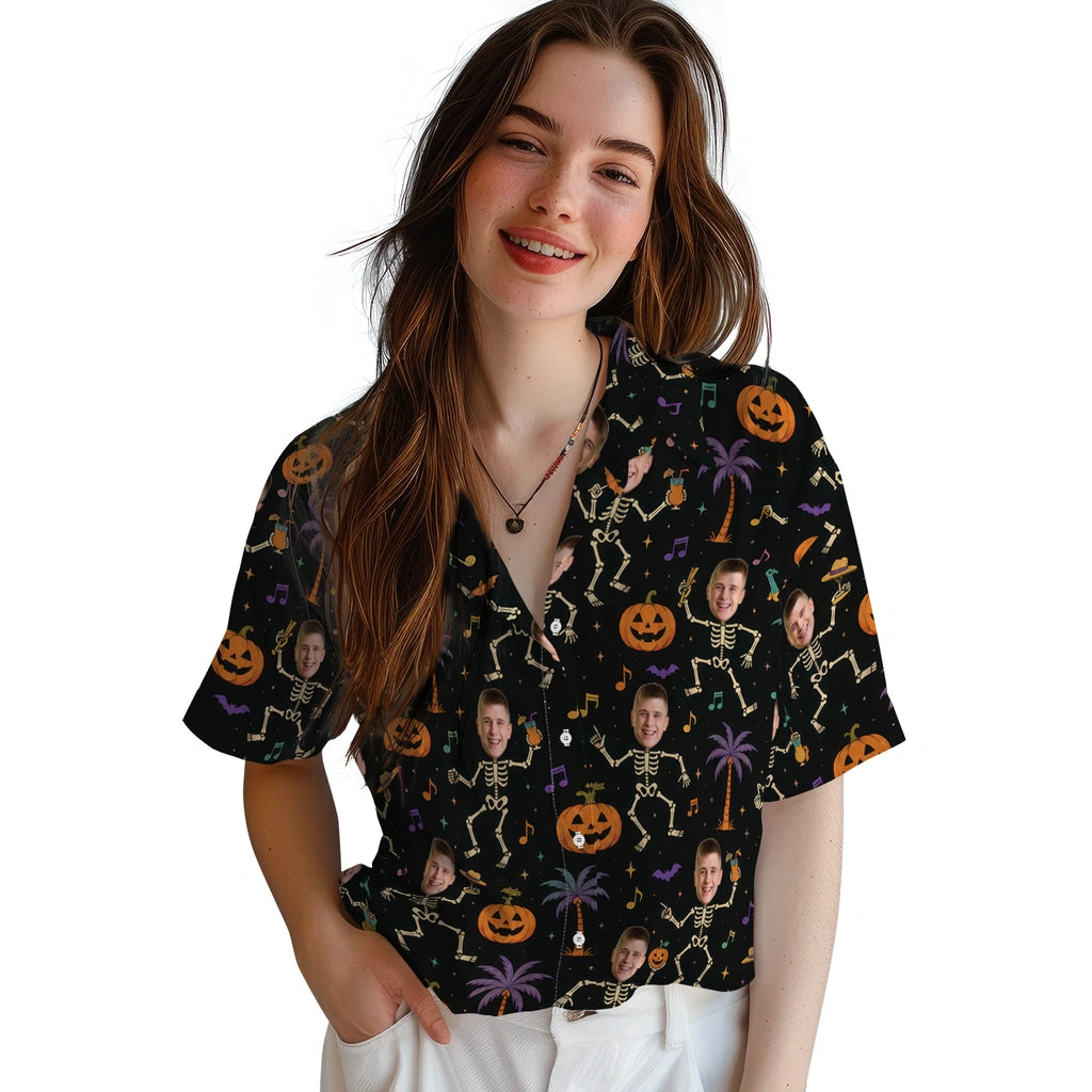 Women's model wearing Spooky Black Dancing Skeletons Custom Hawaiian Shirt in Black